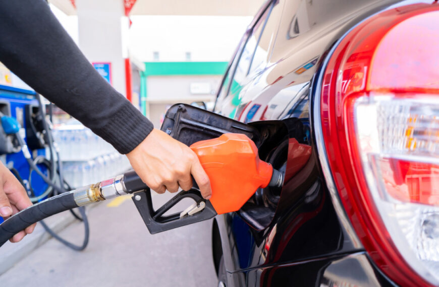 Refuel cars at the fuel pump. The driver hands, refuel and pump the car's gasoline with fuel at the petrol station. Car refueling at a gas station Gas station