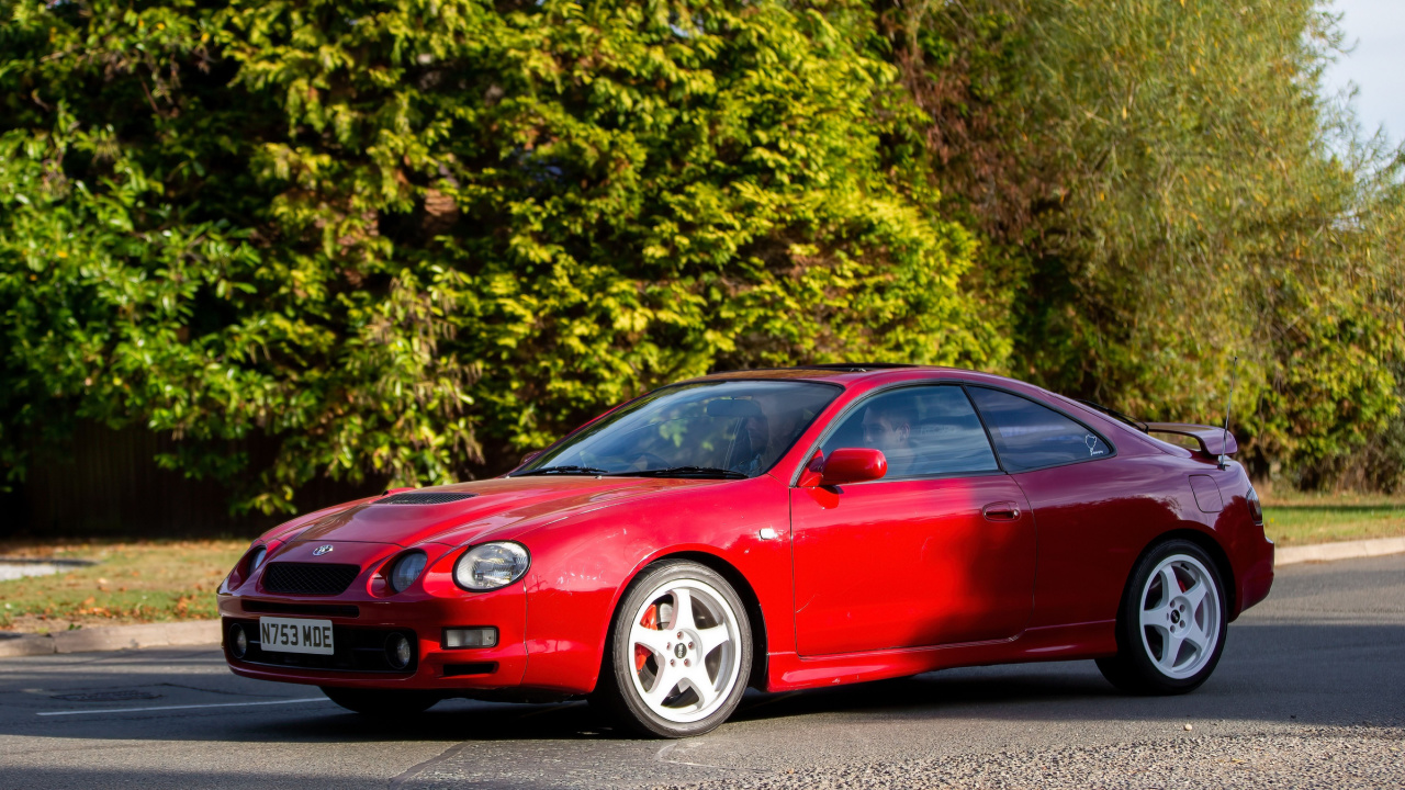 1995 1998 cc red Toyota Celica car driving on an English country road