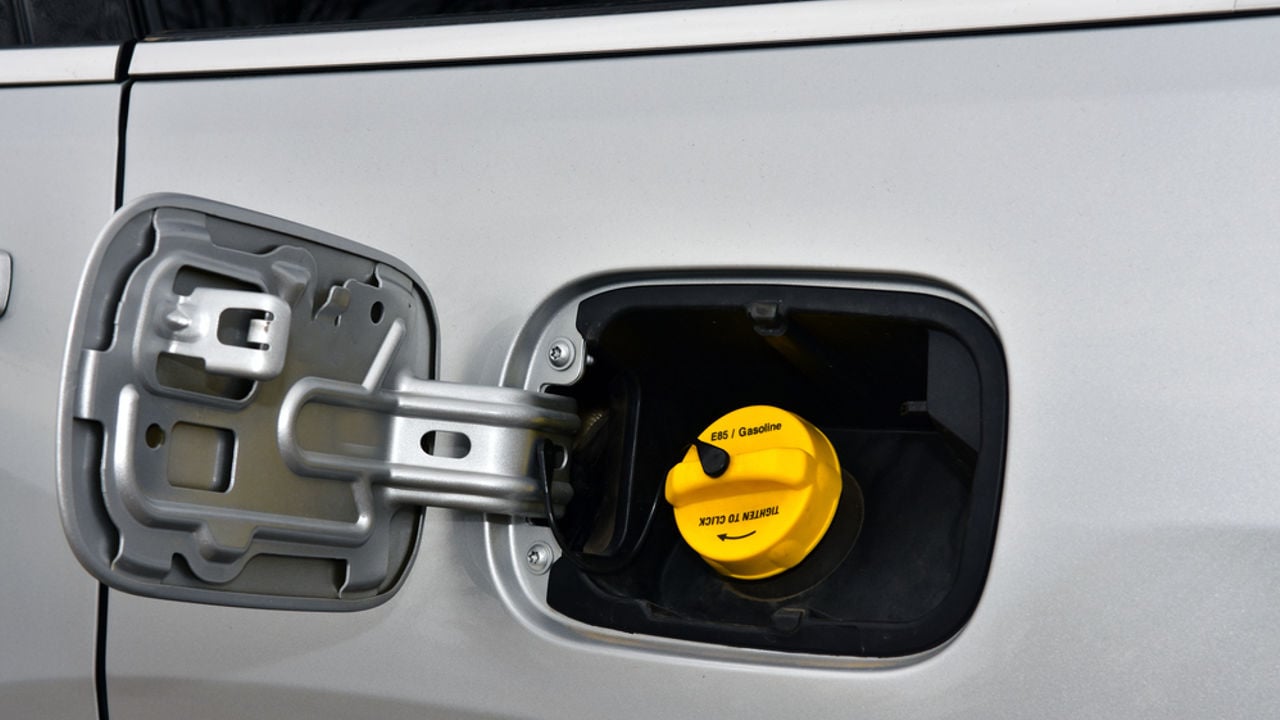 Exterior of car with fuel filler door open.
