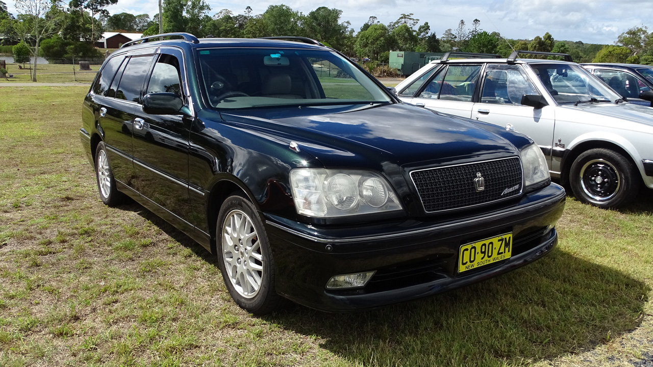 S170 Toyota Crown Athlete station wagon, front 3/4 view, car show, dark green exterior