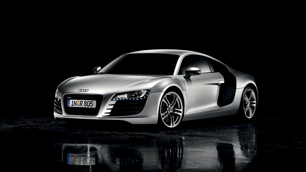 First generation Audi R8, front 3/4 view, silver exterior, dark background