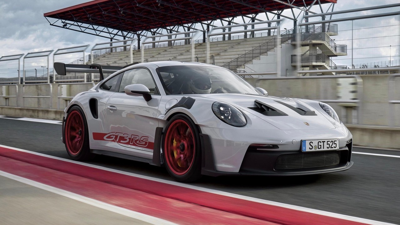 White 2024 Porsche 992 GT3 RS With Red Stripes On Track Front 3/4 View