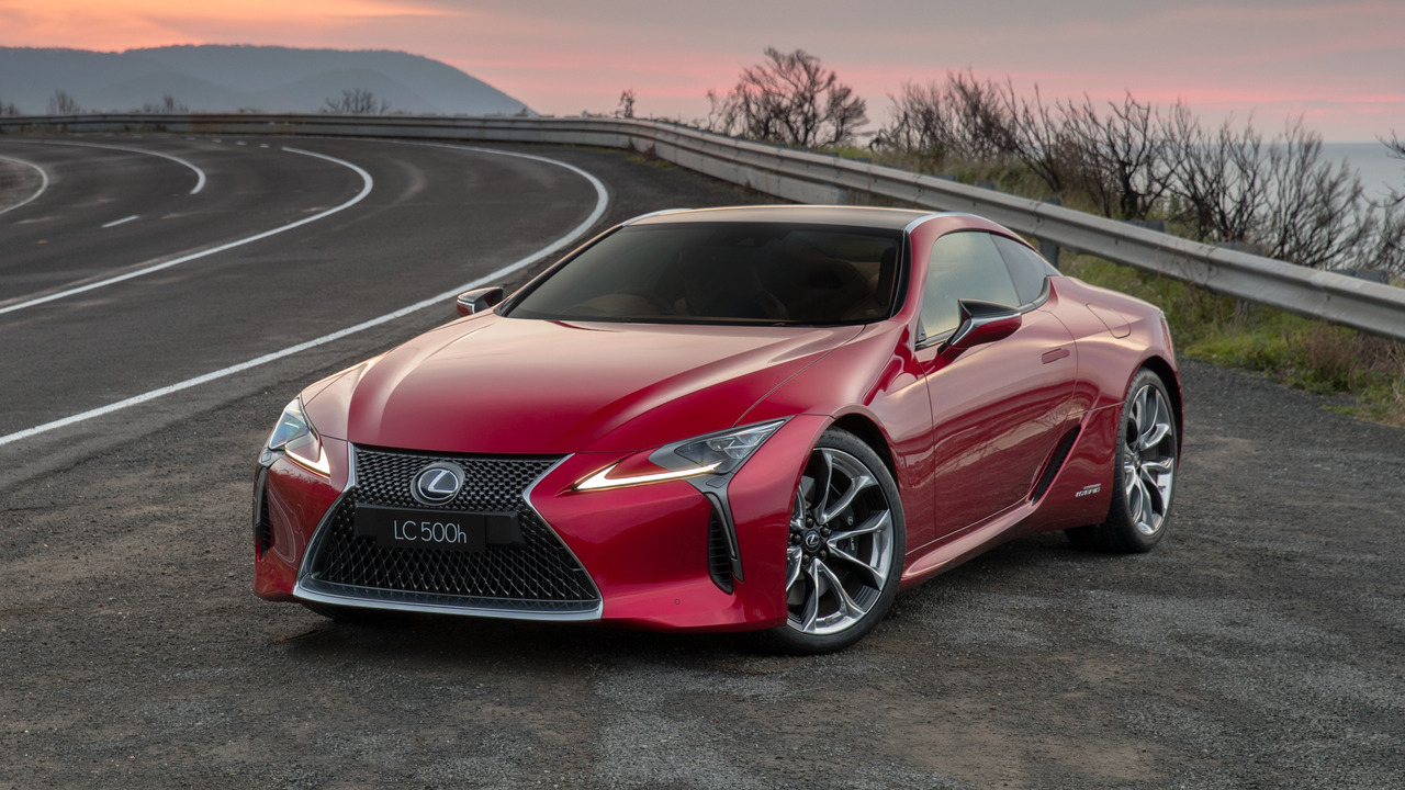 Red 2021 Lexus LC 500 Parked On The Side Of The Road With Sunset