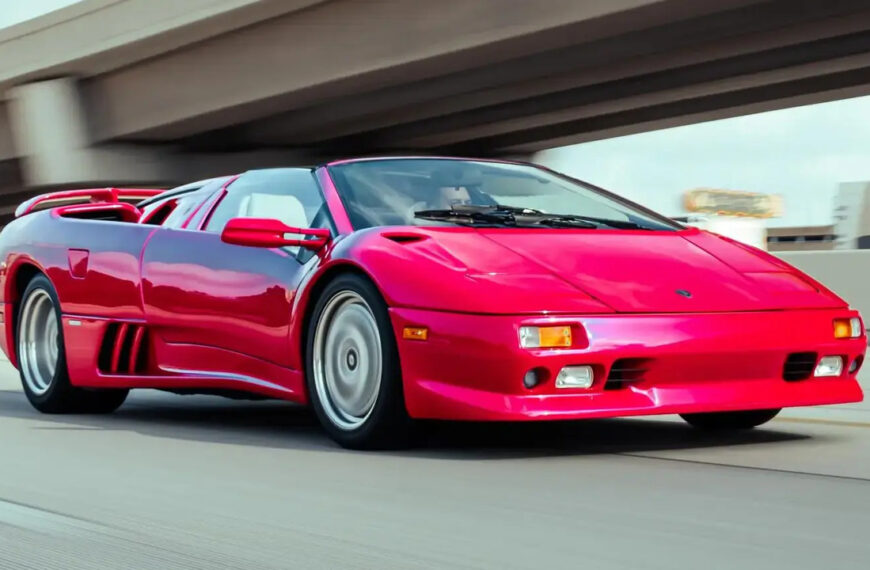 Pink 1996 Lamborghini Diablo VT Roadster On The Road Driving With Roof Down