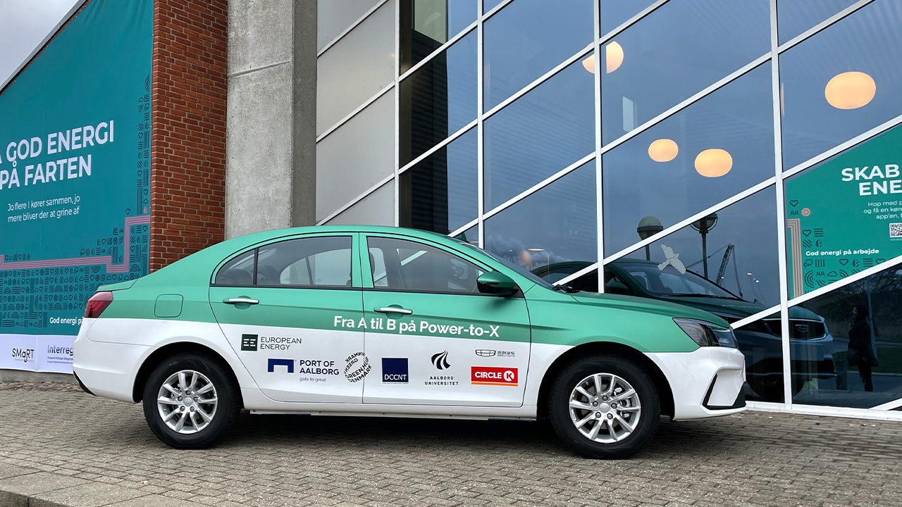 The Geely Emgrand M100 at a press event, side view