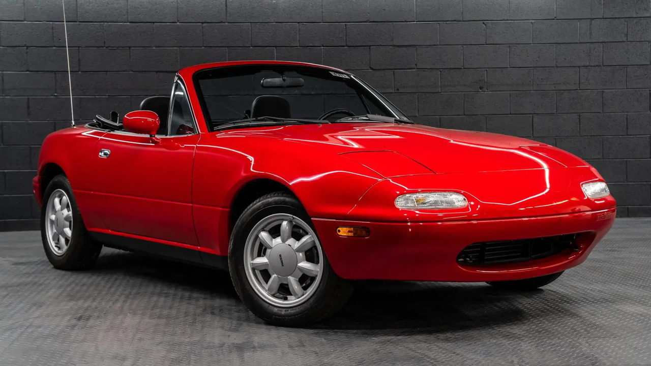 Red 1990 Mazda MX-5 Miata With Roof Down Parked Front 3/4 View