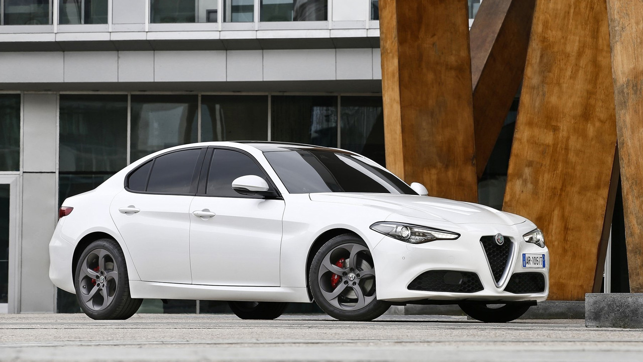 A white base model Alfa Romeo Giulia, front 3/4 view