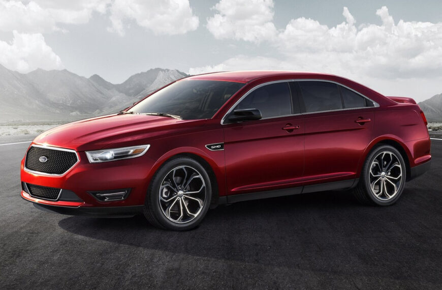 A facelift Ford Taurus SHO in red, front 3/4 view