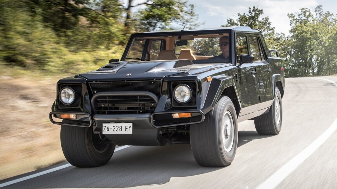 Black Lamborghini LM002 On The Move Front 3/4 View