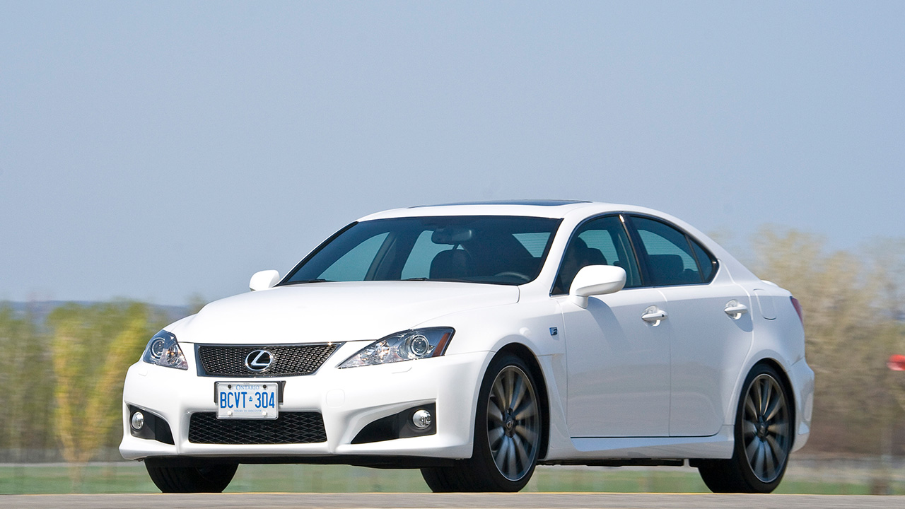 A white Lexus iS F on the move, front 3/4 view