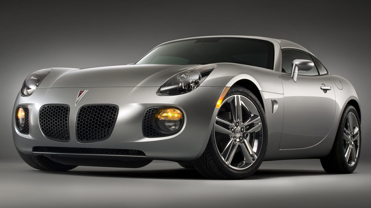 The Pontiac Solstice GXP Coupe in silver, studio shot, front 3/4 view