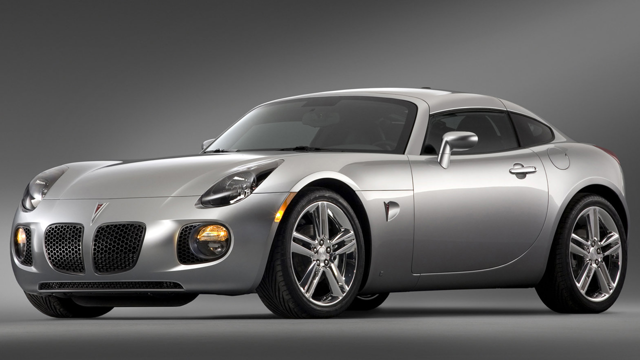 The Pontiac Solstice GXP Coupe in silver, straightened wheels, front 3/4 view, studio shot