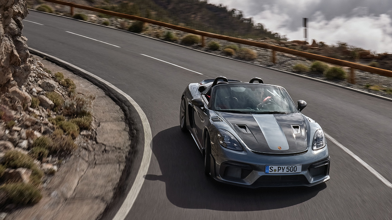 The Porsche 718 Spyder RS on a canyon road, front view, top down