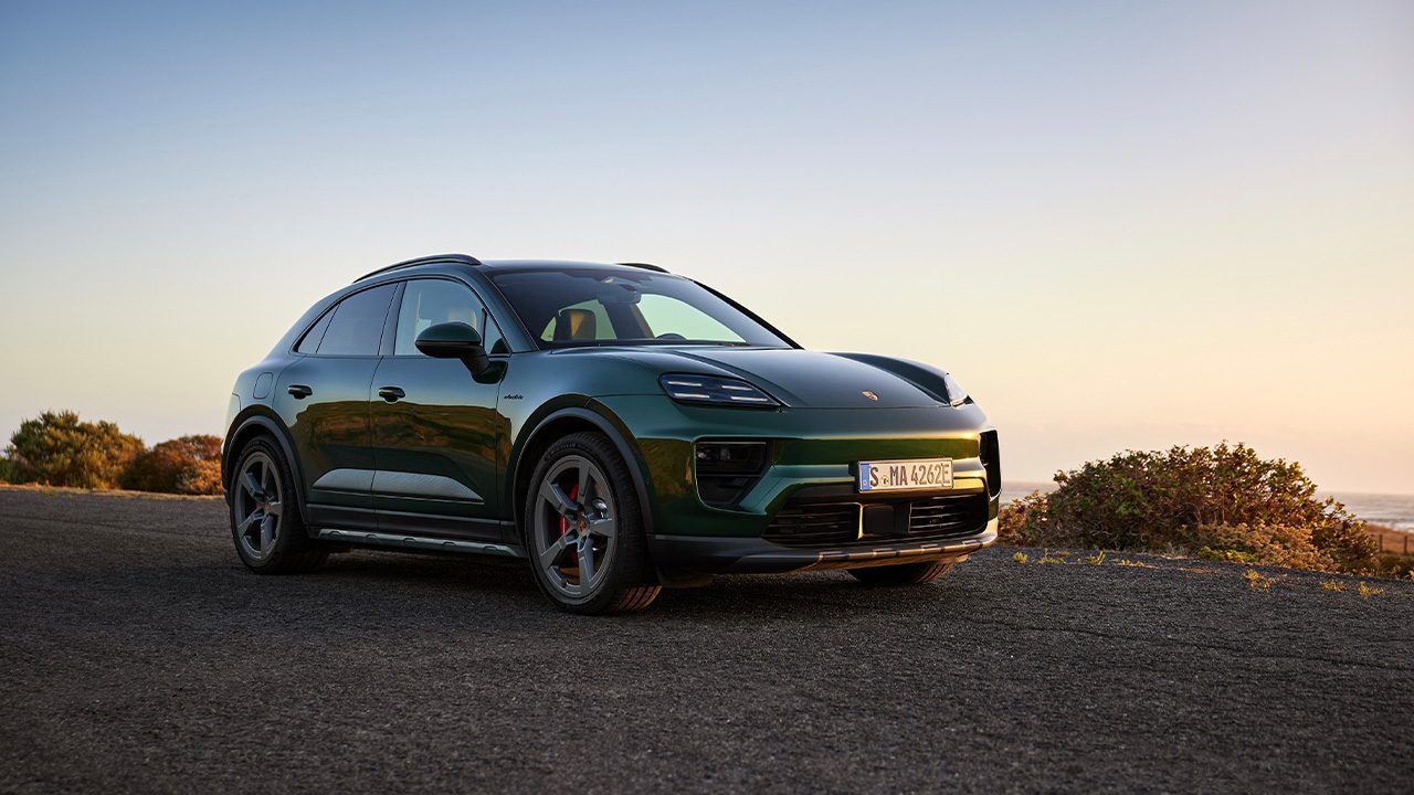 The Porsche Macan Electric in green, front 3/4 view