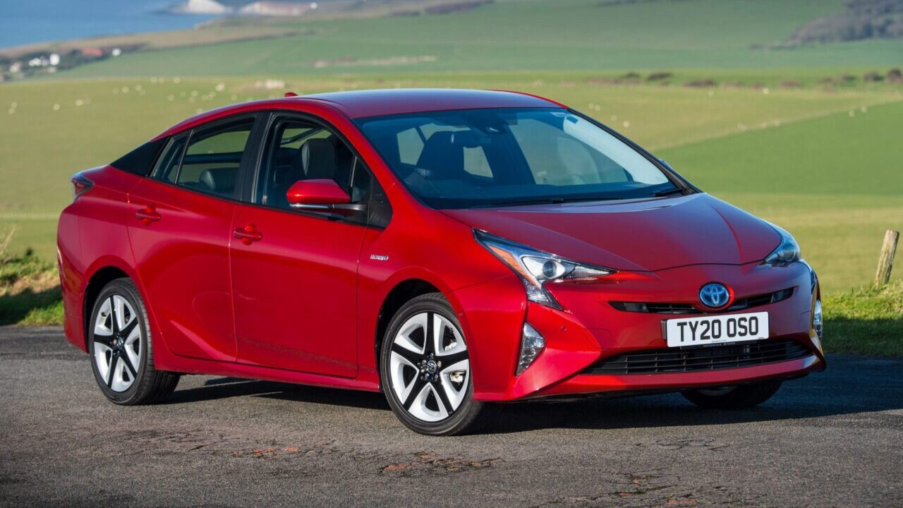 Red Toyota Prius.