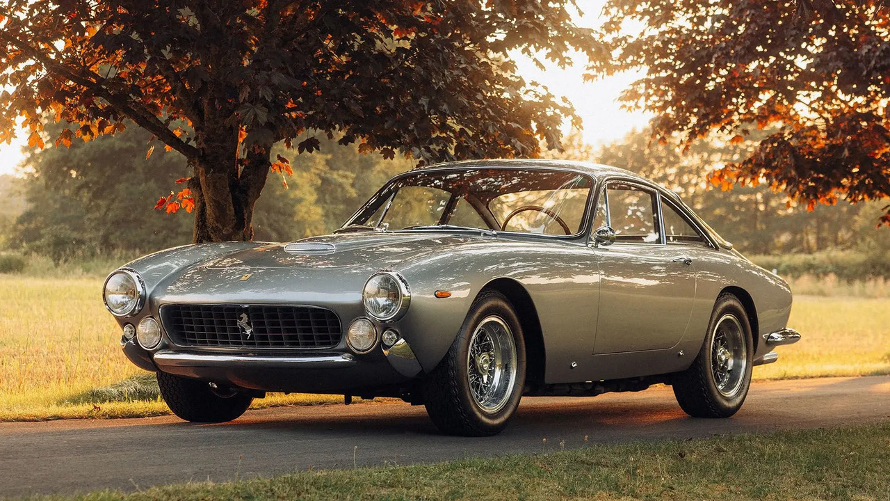 Silver 1963 Ferrari 250 GT Berlinetta Lusso Parked By Sunset Front 3/4 View