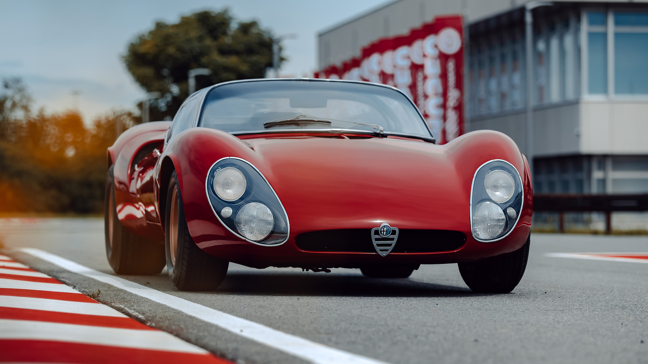 Red 1967 Alfa Romeo 33 Stradale Parked On Track Front 3/4 View