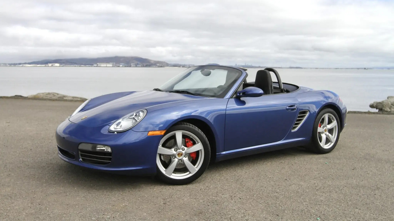 Blue 2007 Porsche 987 Boxster S Parked With Roof Down By Ocean Front 3/4 View