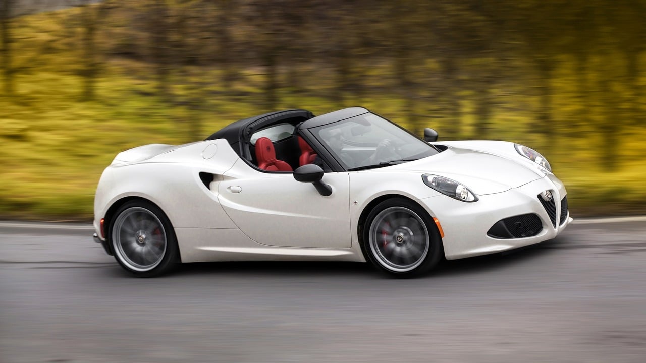 White 2015 Alfa Romeo 4C Spider Driving With Roof Down Front 3/4 View