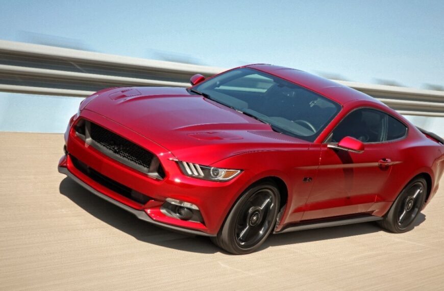 Red 2016 Ford Mustang driving.