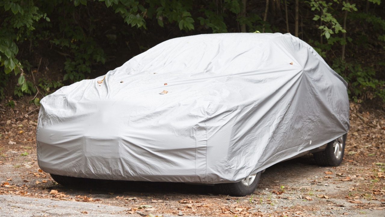 A car parked with a a protective cover