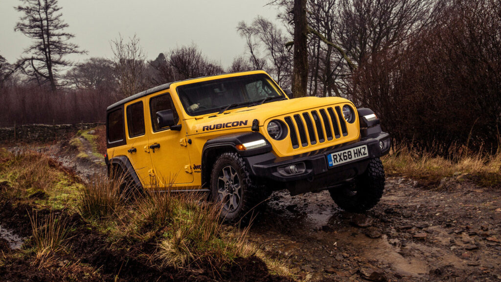 Yellow 2019 Jeep Wrangler Unlimited Rubicon Off-roading Front 3/4 View