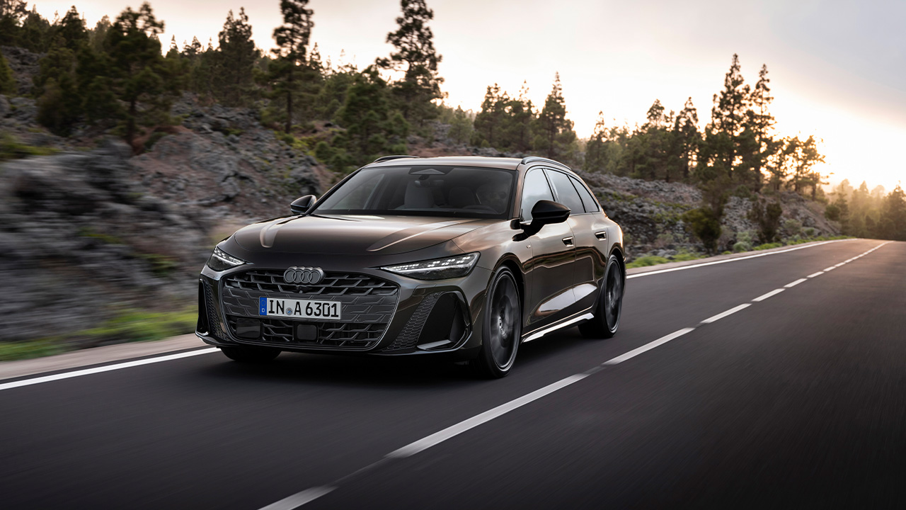 The new Audi A6 Avant in dark brown on the move, front 3/4 view