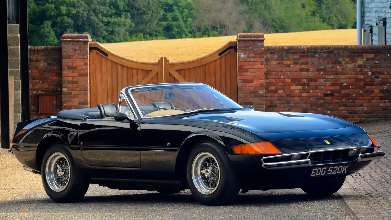 Black 1972 Ferrari 365 GTB4 Daytona Spider Parked With Roof Down Front 3/4 View