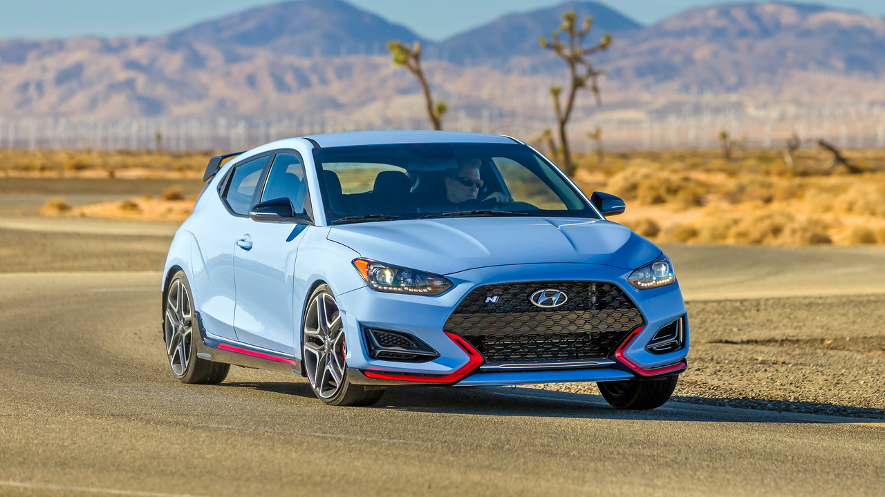 Blue 2021 Hyundai Veloster N Driving On Track Front 3/4 View