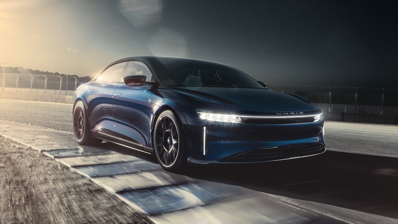 Dark Blue 2023 Lucid Air Sapphire Driving On Track With Lights On Front 3/4 View