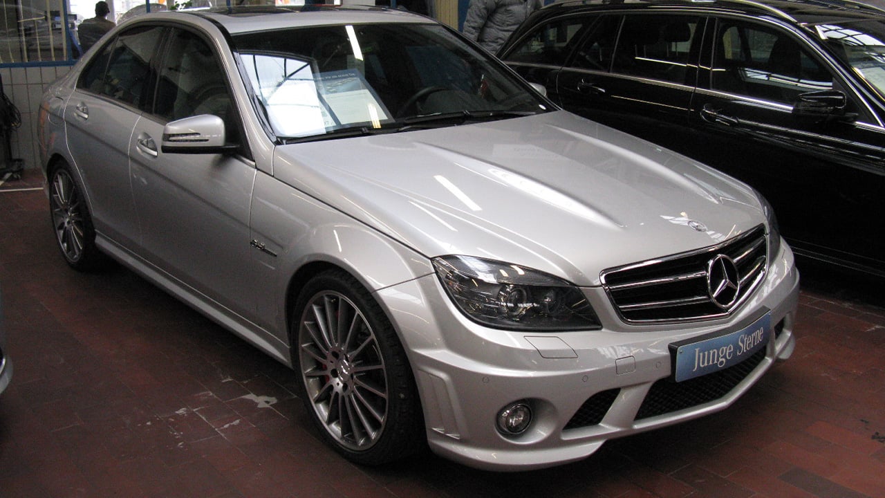A W204 Mercedes C63 AMG in silver, front 3/4 view
