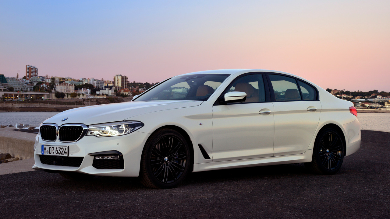 White 2018 BMW G30 540i Parked With Lights On Front 3/4 View