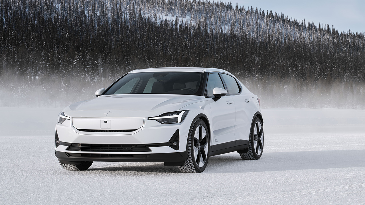 The facelifted Polestar 2 in the snow, front 3/4 view