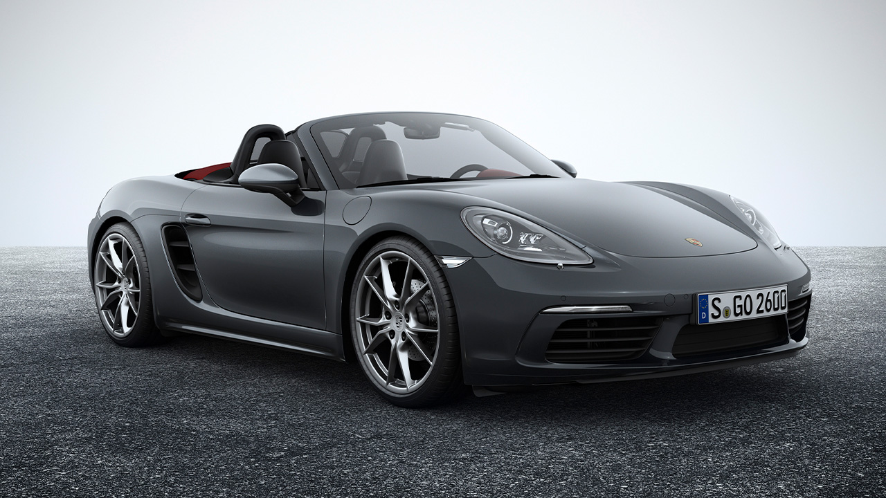 The Porsche 718 Boxster S in gray, front 3/4 view, studio shot, roof down