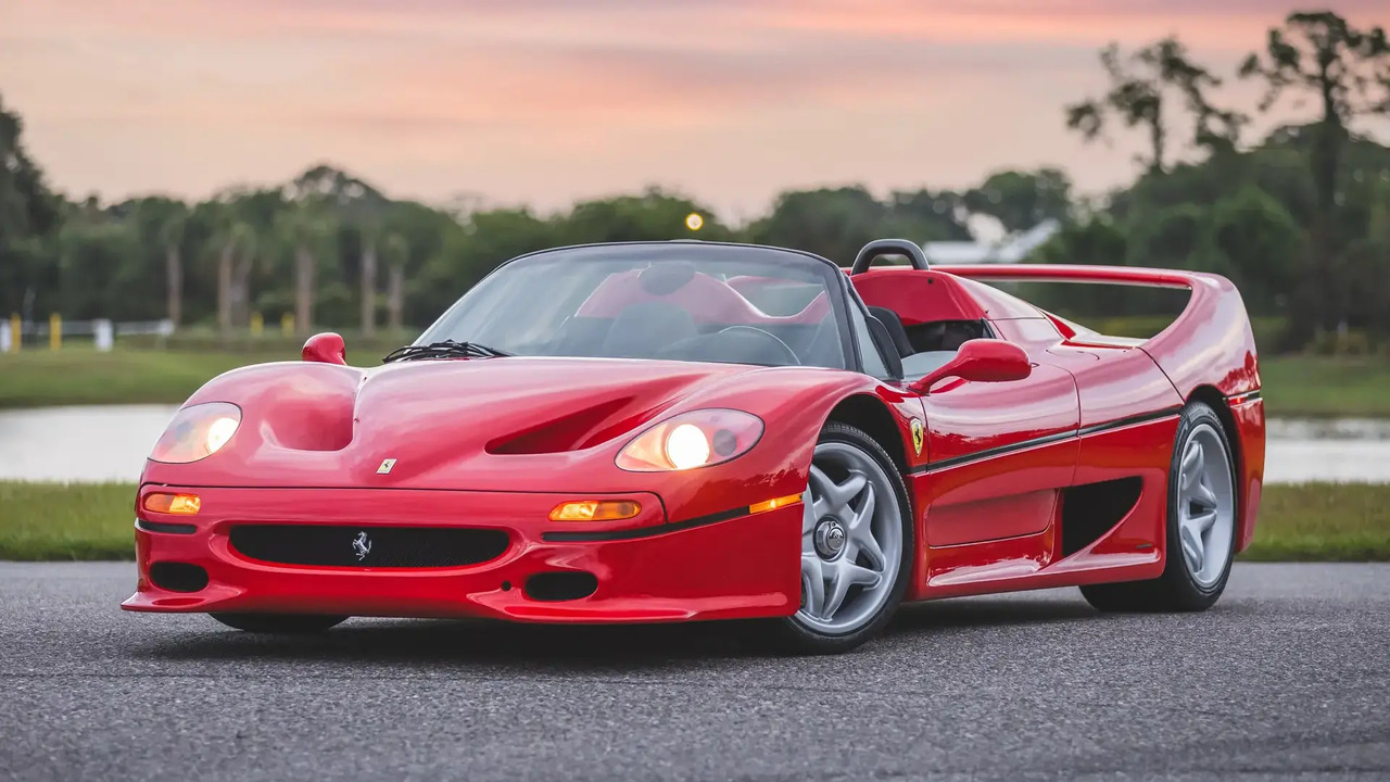 Red 1995 Ferrari F50 Parked With Roof Down And Lights On Front 3/4 View