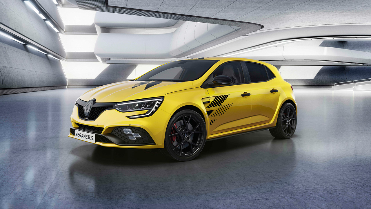 The Renault Megane R.S. Ultime in yellow, front 3/4 view, studio shot