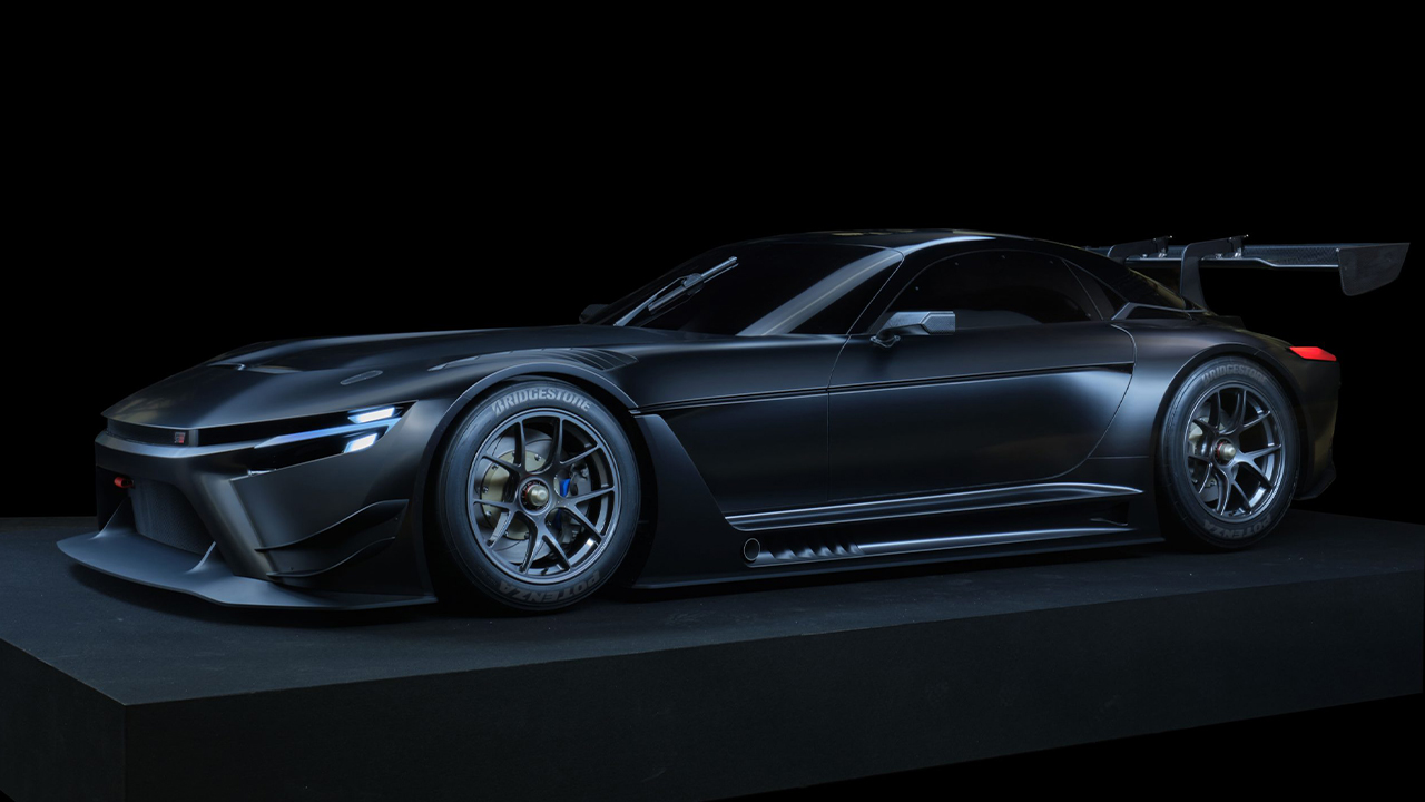 The Toyota GR GT3 Concept, dark studio shot, front 3/4 view