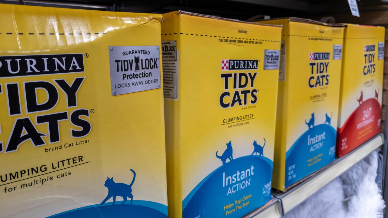 Angled view of Tidy Cats brand litter on shelves inside of a Petsmart store.