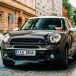 Front View Of Black Mini Cooper Countryman S All4 Sd Car With 2.0 Litre Turbodiesel Engine Parked In Street.