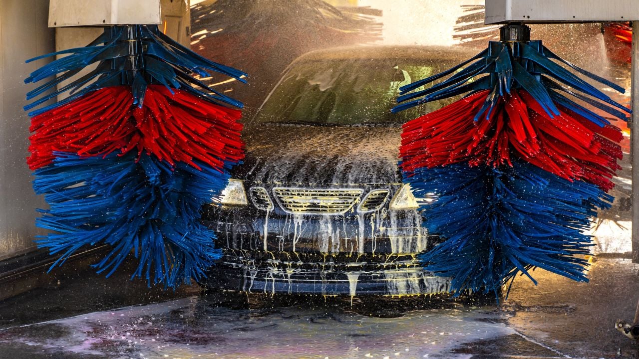 Car going through an automated car wash machine.