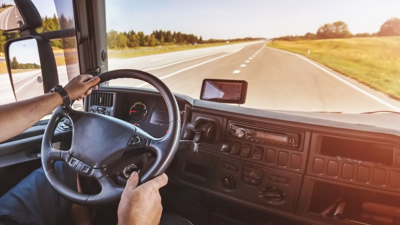 Driver of semi-truck sitting and driving his vehicle