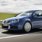 A Mk5 Volkswagen Golf R32 in blue on the move, front 3/4 view