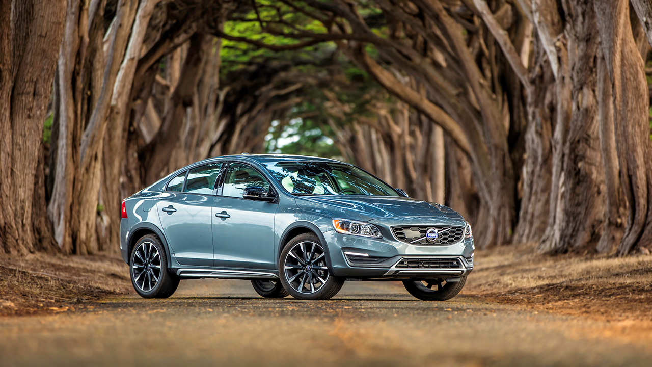 The Volvo S60 Cross Country in blue, front 3/4 view, forest