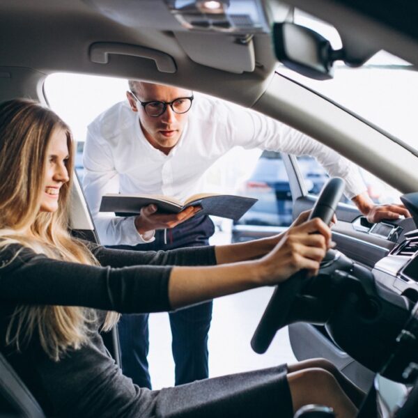 Woman testing a car from a car showroom
