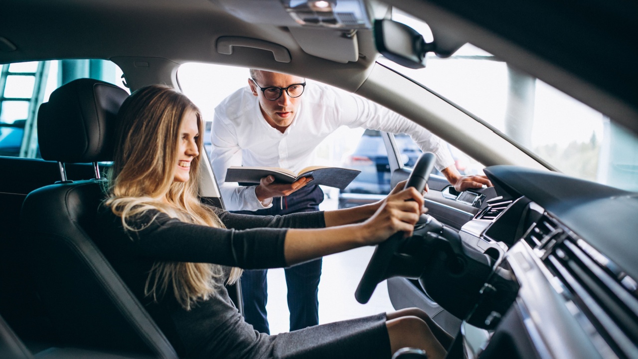 Woman testing a car from a car showroom