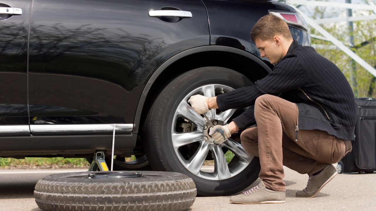changing tire on road