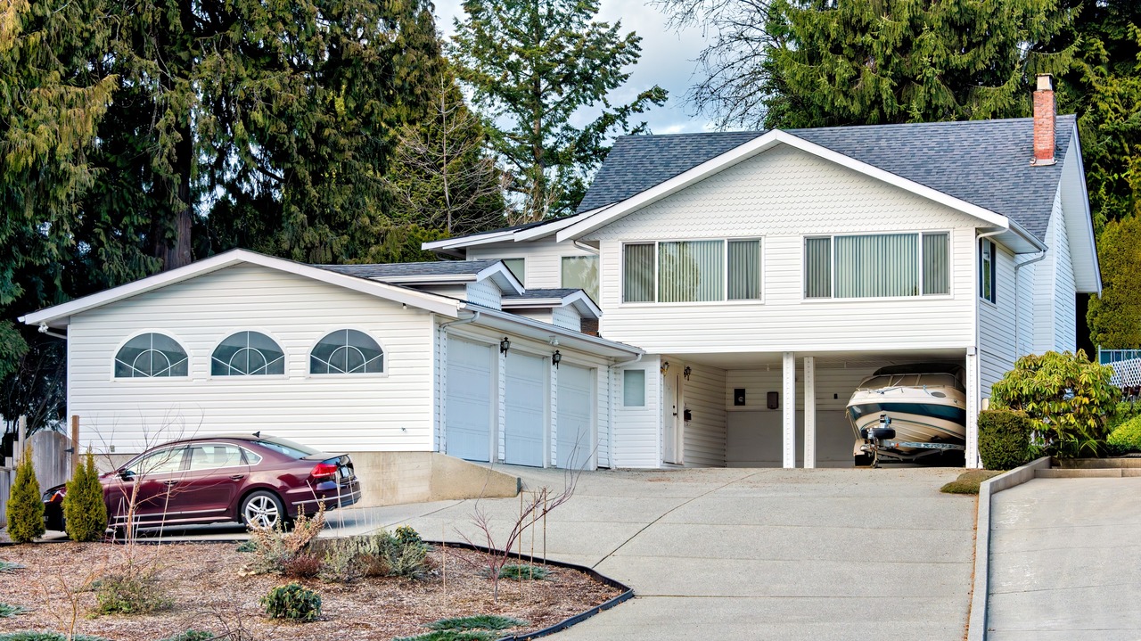 A house with a car and boat.