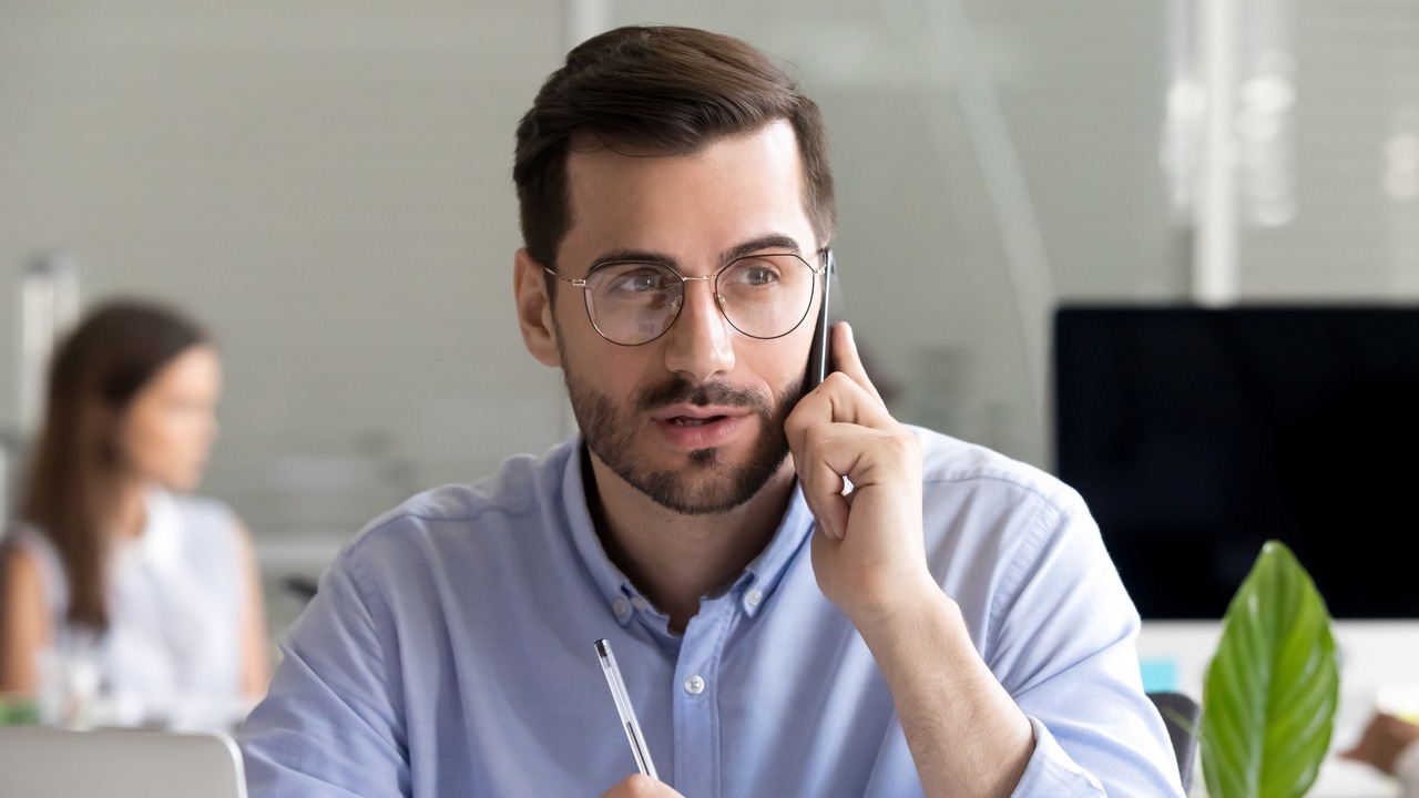 A young man talking on the phone.