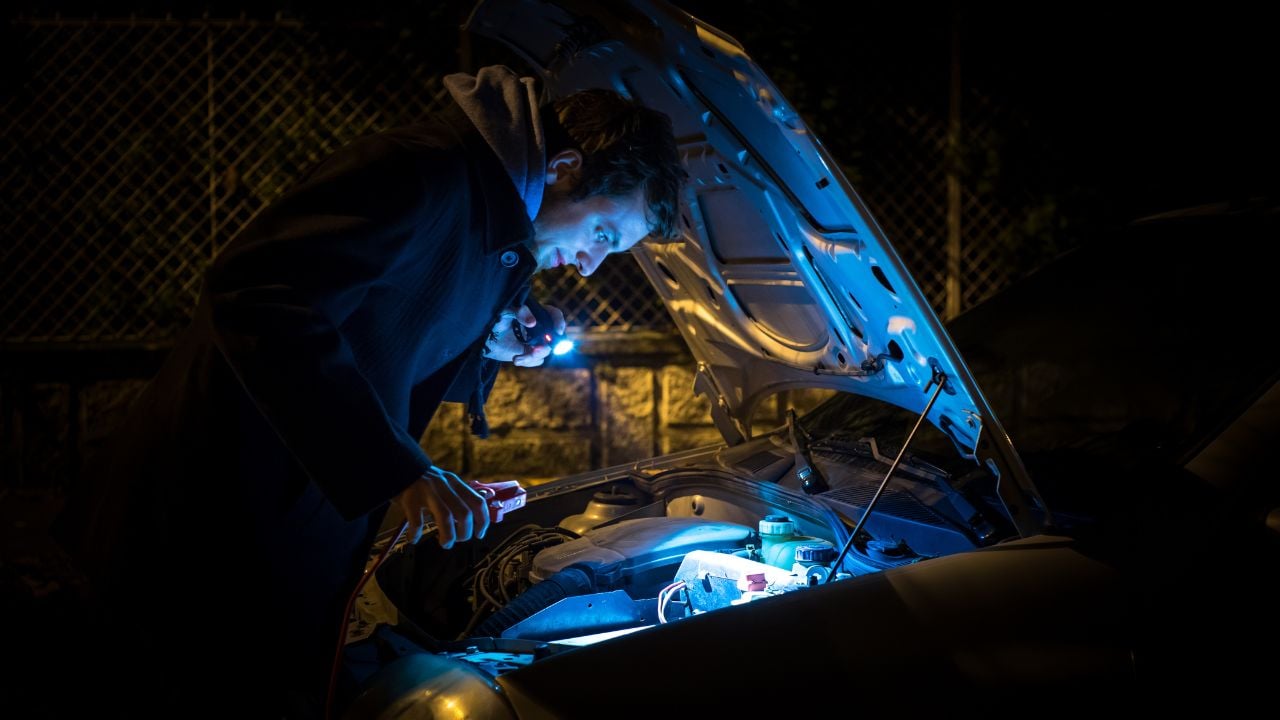 using flashlight to check engine