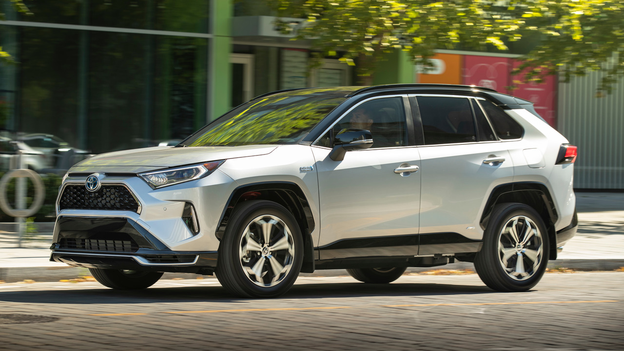 Silver 2021 Toyota RAV4 Prime With Black Roof On The Move Front 3/4 View